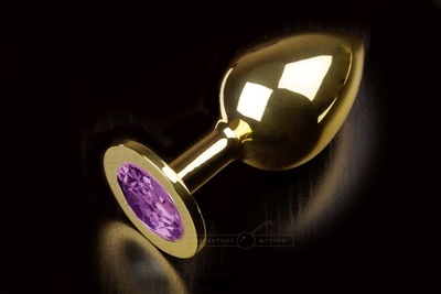 Большая золотая анальная пробка с закругленным кончиком и фиолетовым кристаллом - 9 см. Пикантные штучки (фиолетовый) 